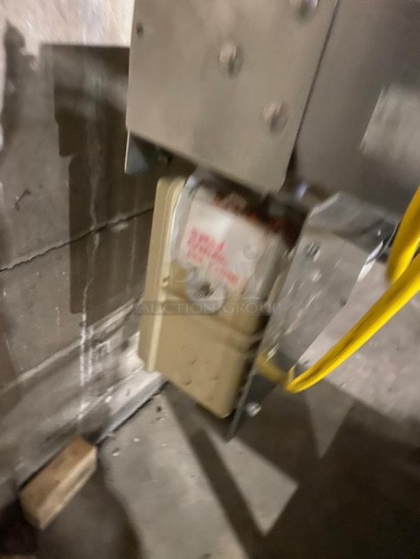 Rondo Floor Style Belt Conveyor System, metal and mechanical components visible, used condition, sturdy build.