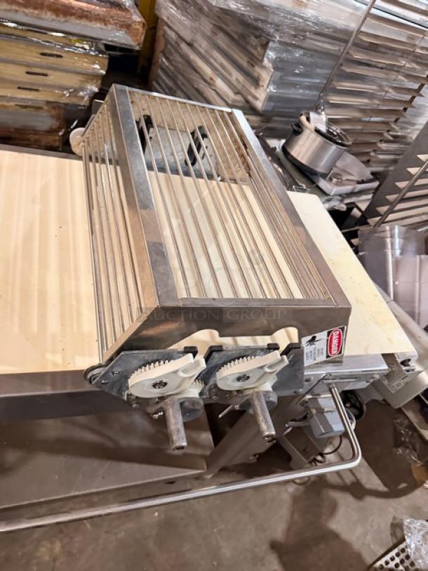 Rondo Seewer belt conveyor, model SBEVERR, on casters. Features adjustable rollers and visible serial B8102304. Excellent condition.