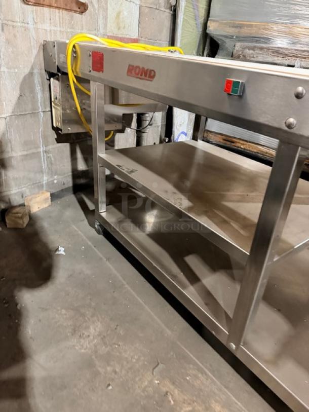 Aluminum Seewer Rondo SBEVERR floor style belt conveyor system, serial B8102304, on casters, features brand logo.