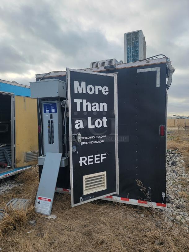 Diamond Cargo 24' Mobile Kitchen Trailer with professional wrap, showing rear with open door. Tags read "More Than a Lot" and "REEF."