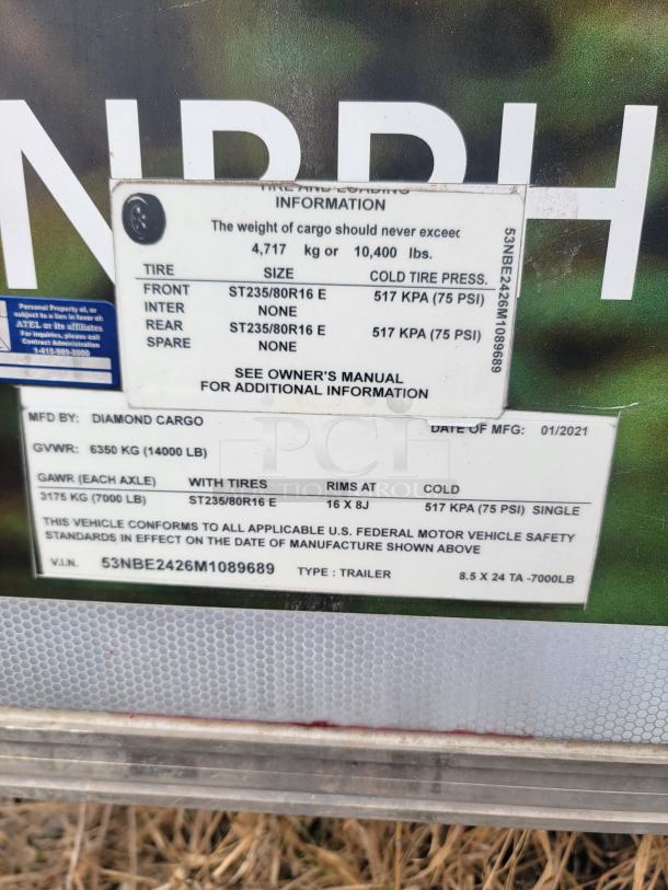 VIN plate on a Diamond Cargo 24' Mobile Kitchen Trailer, model year 2021, showing tire and loading information.