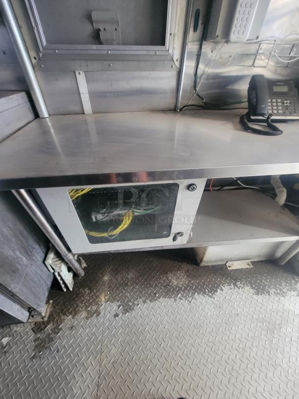 Diamond Cargo 24' mobile kitchen trailer, stainless steel interior, ample counter space, visible wiring, 2021 model.