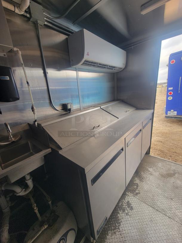 24' Diamond Cargo mobile kitchen trailer interior featuring stainless steel prep station and professional-grade sink.