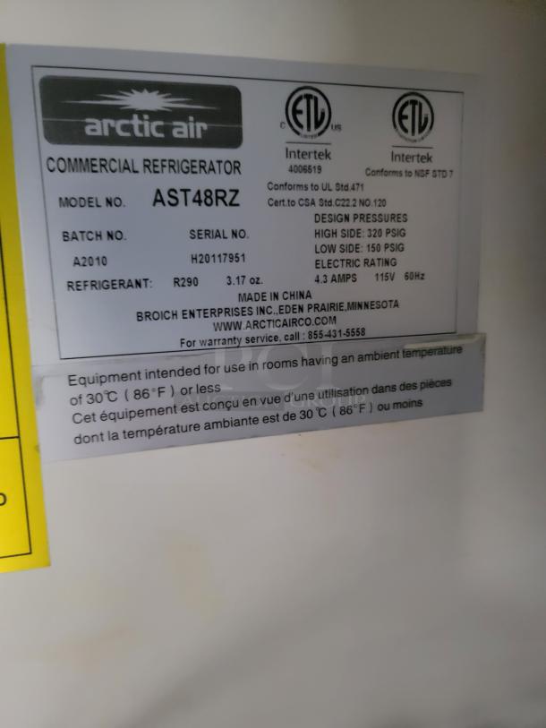 Arctic Air commercial refrigerator label. Model AST48RZ, serial H20117951, 3.17 oz R290 refrigerant. 115V, 4.3 amps.