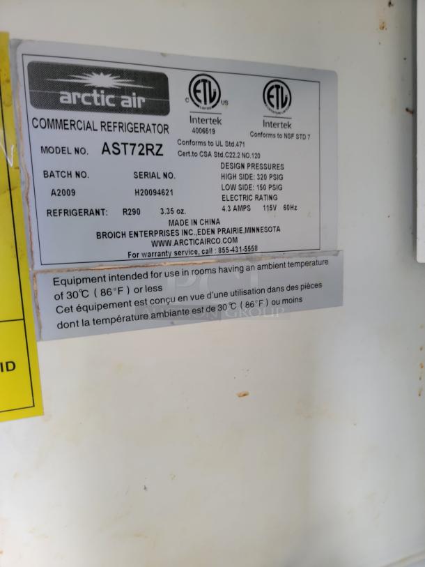 Arctic Air commercial refrigerator label, model AST72RZ. Details design pressures, refrigerant, and electrical specs.
