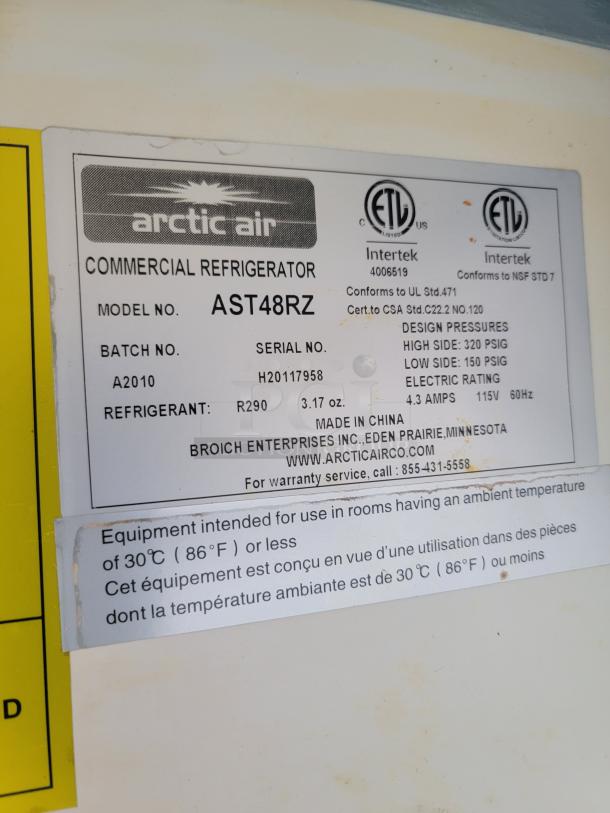 Label on Arctic Air commercial refrigerator model AST48RZ, batch A2010, serial H20117958, 115V, 60Hz, R290 refrigerant.