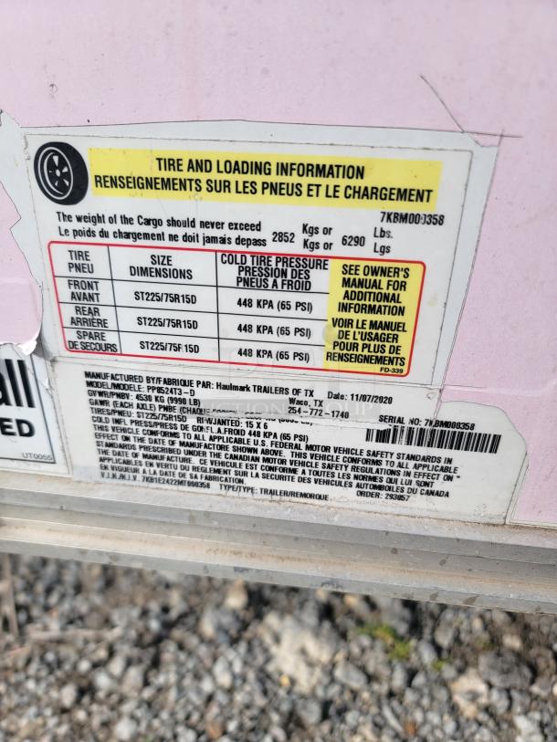 Label showing tire and loading information for a Haulmark trailer, VIN: 7KB1E2422MT000358, with specifications and safety standards.