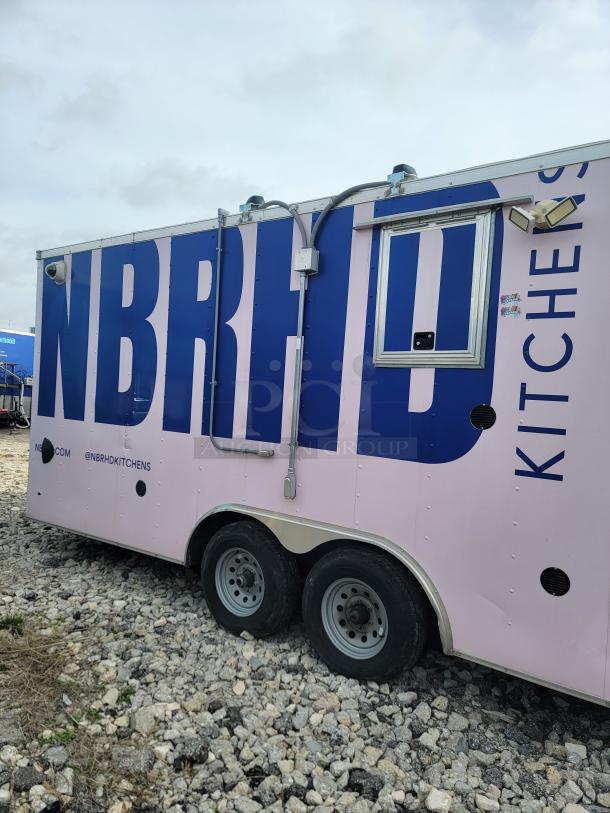 Haulmark 24' mobile kitchen trailer, NBRHD Kitchens branding, premium refrigeration, fire suppression, climate control.