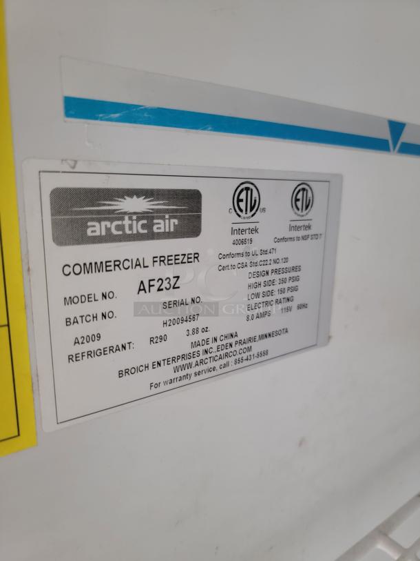 Arctic Air commercial freezer model AF23Z label, detailing refrigerant, batch number, and manufacturer contact.