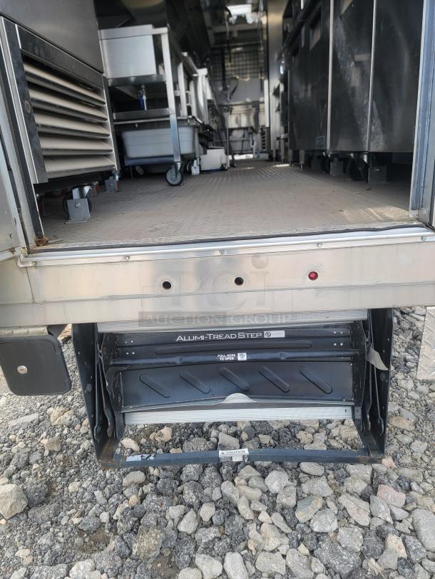 2021 Texino FD-306 mobile kitchen, triple axle, stainless steel, interior shows commercial equipment; needs cleaning.