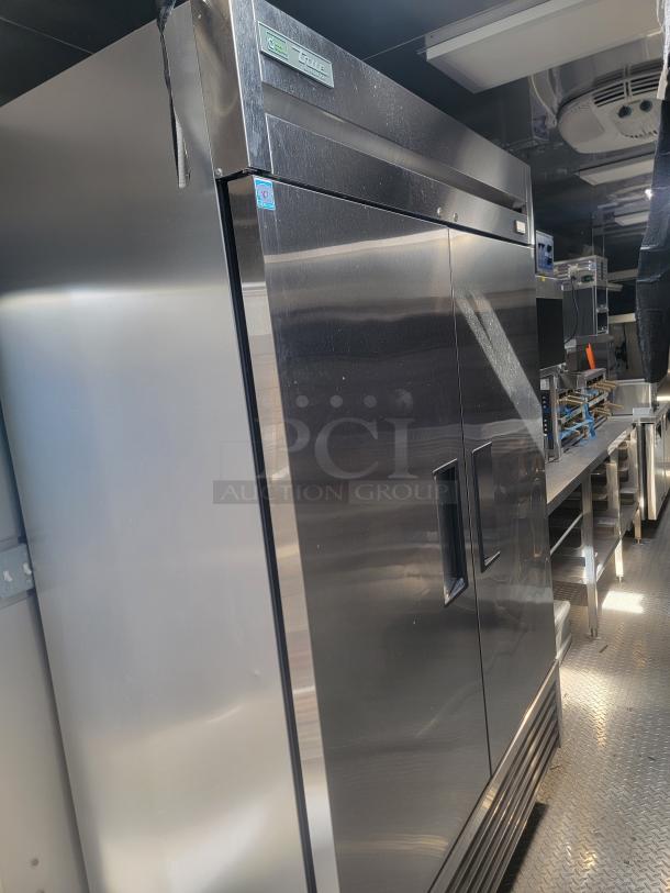 Stainless steel True refrigeration unit inside a 2021 Texino FD-306 mobile kitchen on display. Rugged and spacious interior.