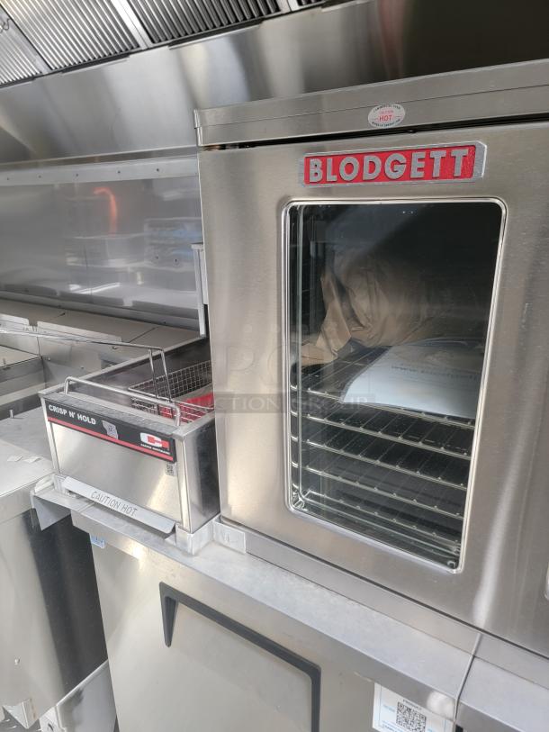 2021 Texino FD-306 mobile kitchen interior, featuring a Blodgett convection oven with stainless steel finish and a Crisp N' Hold warming unit. Needs cleaning.