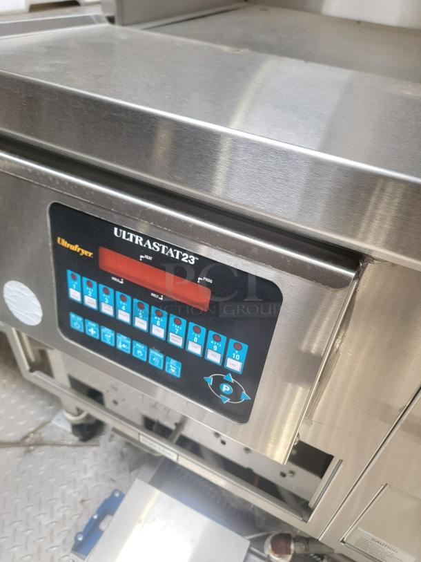 Ultrafryer UltraStat23 control panel on a 2021 Texino FD-306 mobile kitchen. Features buttons and digital display. Stainless steel finish.