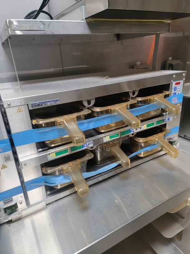 Stainless-steel commercial oven inside a 2021 Texino FD-306 mobile kitchen. Features multiple trays, light wear visible.