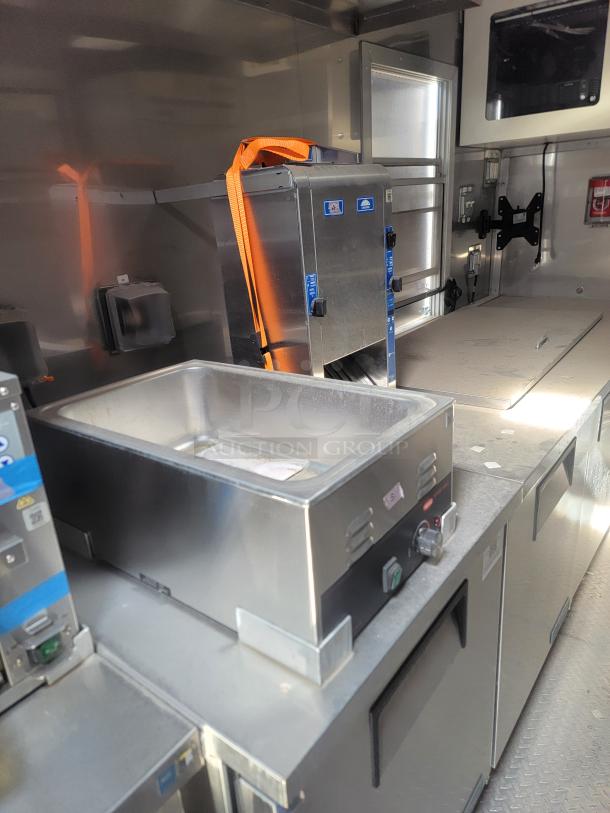2021 Texino FD-306 mobile kitchen interior with stainless steel equipment, including a Blodgett convection oven and True refrigeration. Needs cleaning.