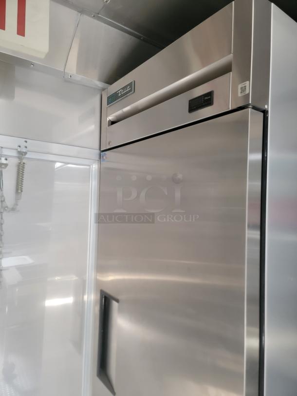 Stainless steel True refrigeration unit inside Texino FD-306 mobile kitchen, featuring a sleek design and digital display for temperature control.