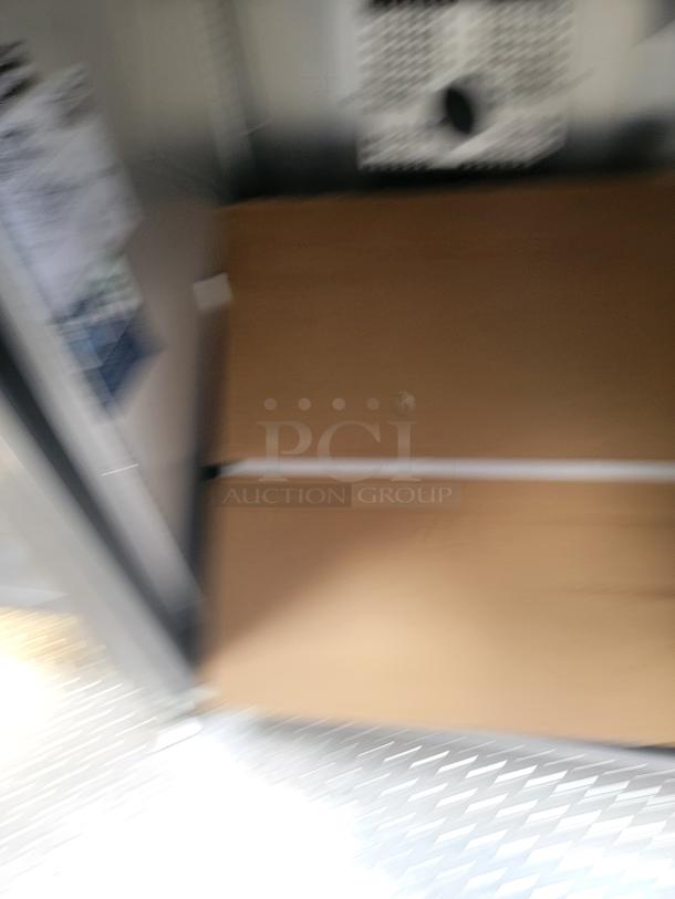 Blurred interior view of the 2021 Texino FD-306 mobile kitchen with a triple-axle frame. No labels visible.