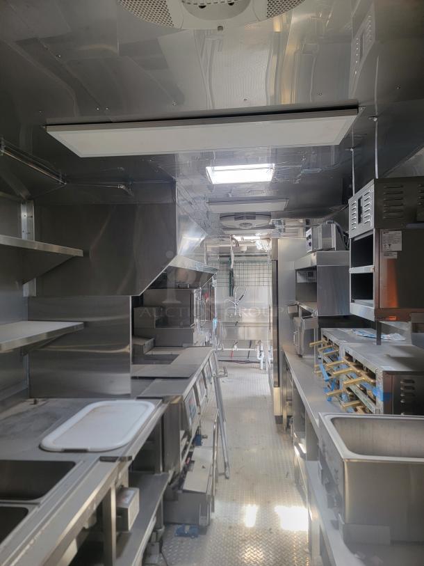 2021 Texino FD-306 mobile kitchen interior, features stainless-steel surfaces, Blodgett convection oven, True refrigeration. Needs cleaning.