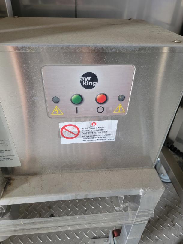 Ayr King control panel on Texino FD-306 mobile kitchen, featuring buttons and warnings, in need of cleaning.