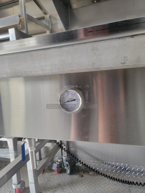 2021 Texino FD-306 mobile kitchen interior, featuring a stainless steel surface with gauge and industrial wheels. Needs deep clean.