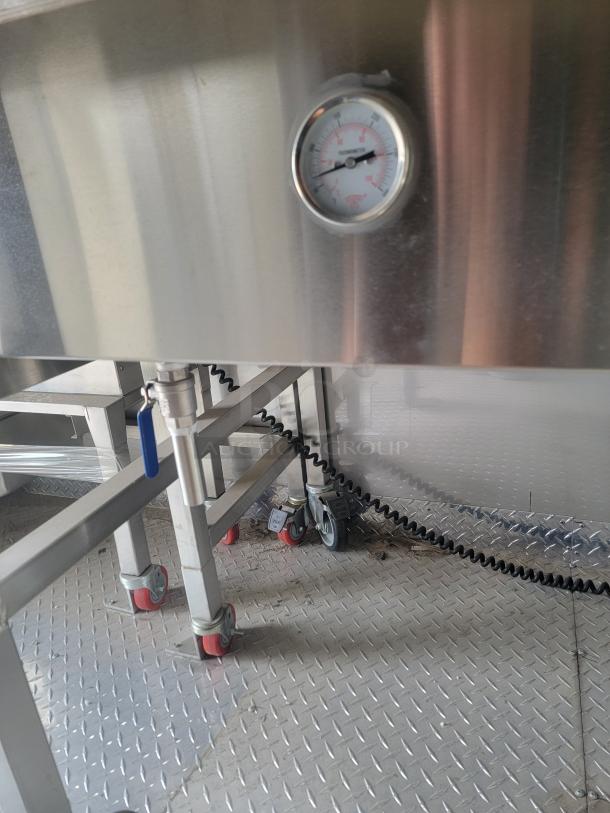 Stainless steel interior of 2021 Texino FD-306 mobile kitchen, showing a temperature gauge, metal surfaces, and caster wheels.