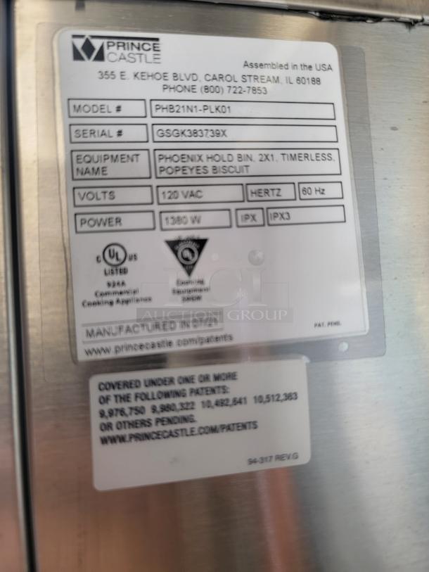 Tag detail on Phoenix Hold Bin by Prince Castle. Model PHB21N1-PLK01, Serial GSGK383739X. 120VAC, 1380W, 60Hz.