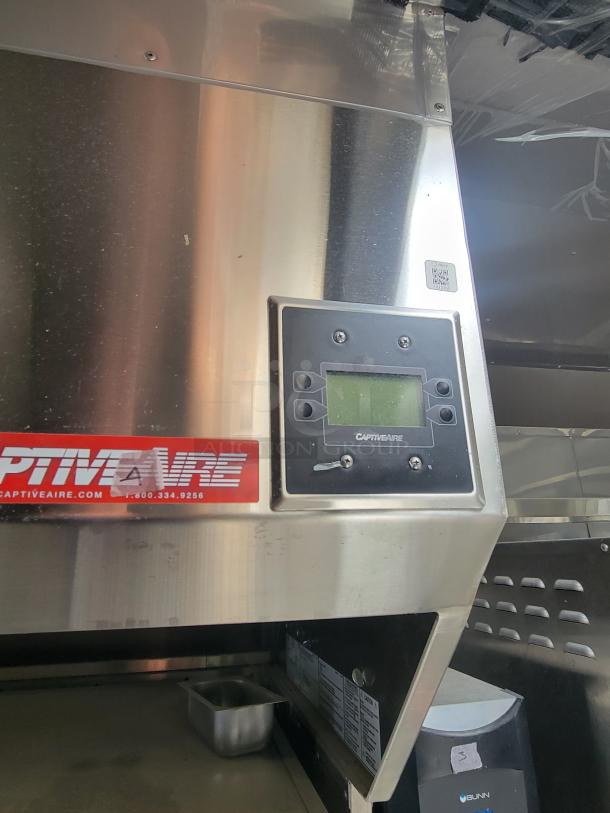 Stainless steel CaptiveAire control panel on 28' Texino FD-306 mobile kitchen. Needs TLC for restoration.