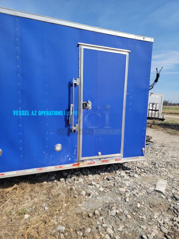 Blue 2020 Diamond Cargo 24' mobile kitchen trailer with side entry. Rugged design for commercial use, VIN: 53NBE2428M1083702.
