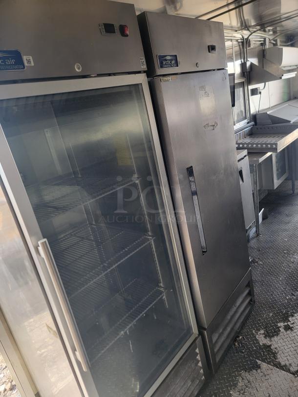 Diamond Cargo 24' mobile kitchen with Arctic Air fridge/freezer, commercial griddle, range, and prep station, excellent condition.
