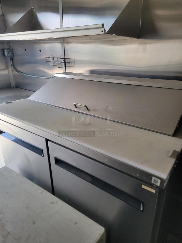 2020 Diamond Cargo mobile kitchen interior with stainless steel workspace, featuring a True manufacturing prep station.