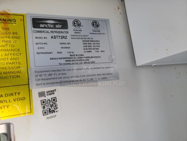 Label showing Arctic Air commercial refrigerator model AST72RZ specifications. Includes QR code for Smart Care.