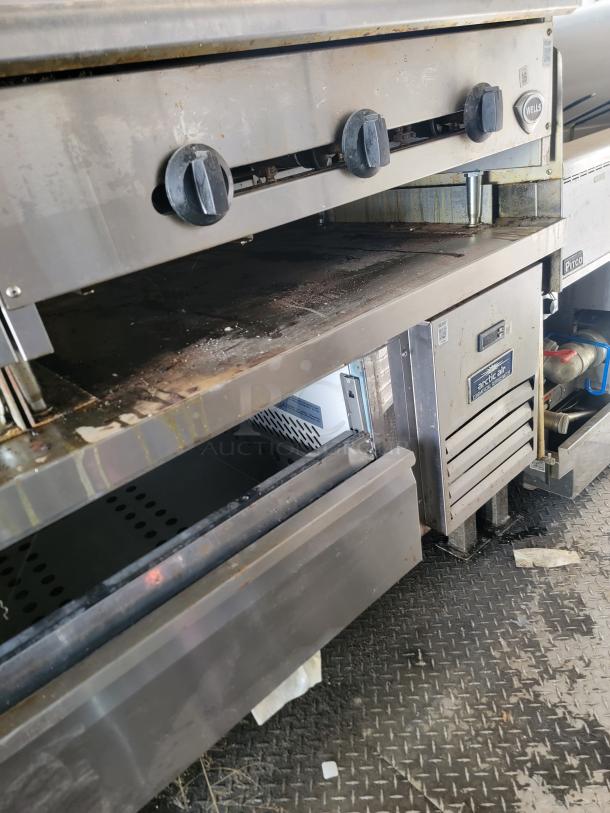 24' Diamond Cargo 2020 mobile kitchen showing Wells griddle, Arctic Air fridge, and Pitco fryer; stainless steel finish.