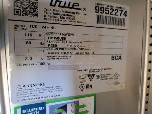 True Manufacturing label showing model TUC-24-HC, serial number 9952274, refrigerant details, and compliance warnings.