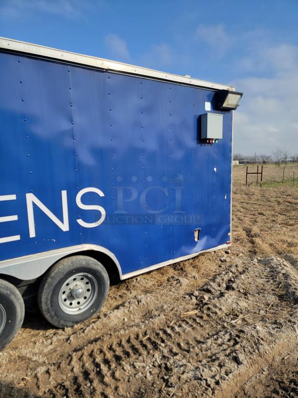 2019 Quality Cargo 24' mobile kitchen trailer, blue exterior, visible wear. Features Garland range, needs interior and body TLC.