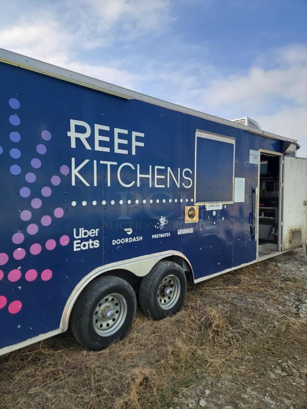 2019 Quality Cargo 24' mobile ghost kitchen with branding logos. Features tandem axles; needs interior clean and exterior TLC.