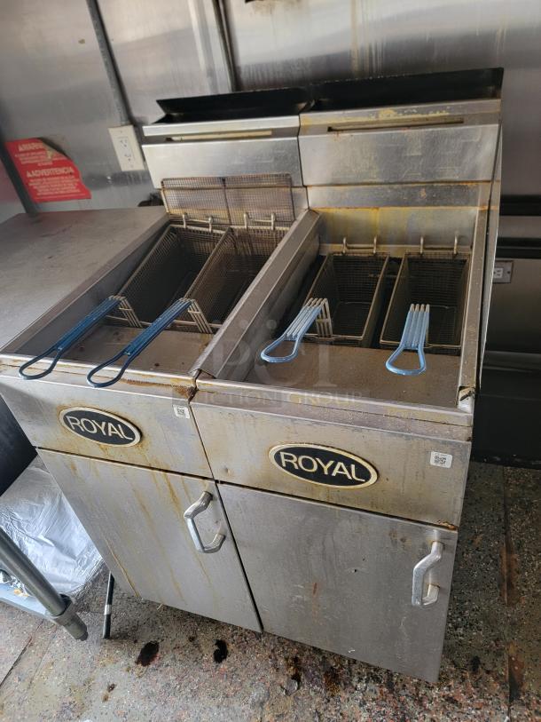 Dual deep fryers in used condition, part of a mobile kitchen. Royal branding, needs cleaning and exterior refurbishment.
