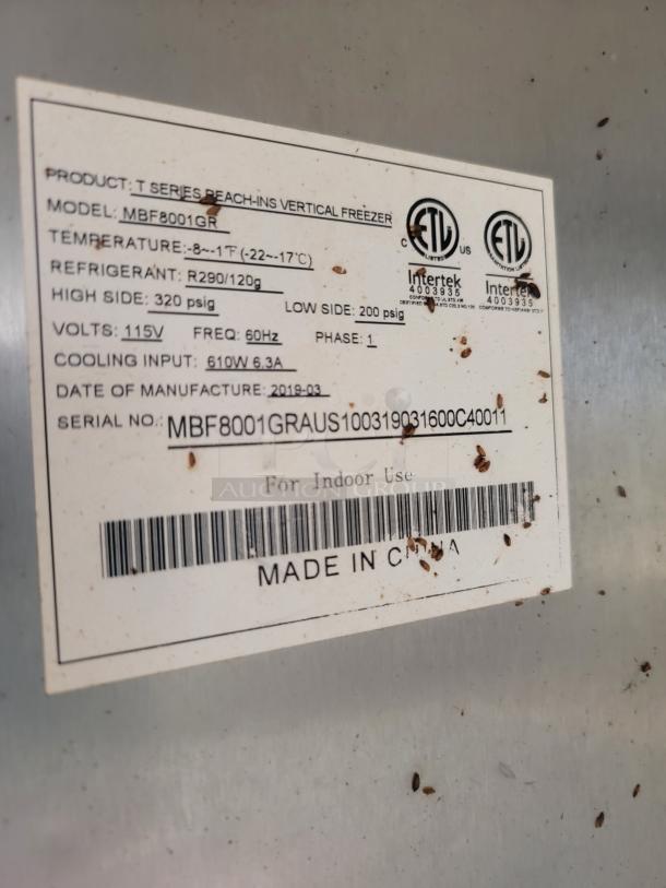 Label on a T Series reach-in vertical freezer, model MBF8001GR, showing specifications and ETL certifications. Made in China.