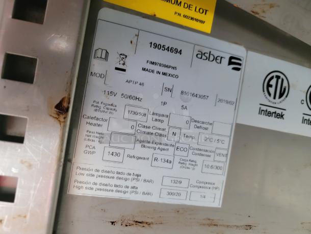 Label on equipment indicates Asber brand, model FMF930306PH5. Features 115V, refrigeration specs, and ETL certification.
