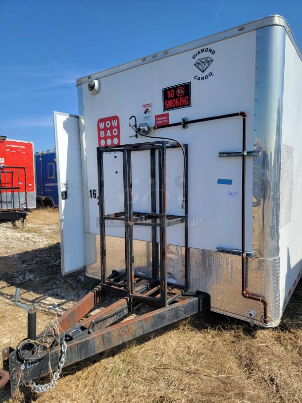 2021 Diamond Cargo 24' mobile kitchen trailer with heavy-duty frame, "WOW BAO" and "NO SMOKING" signs, and propane hookup.
