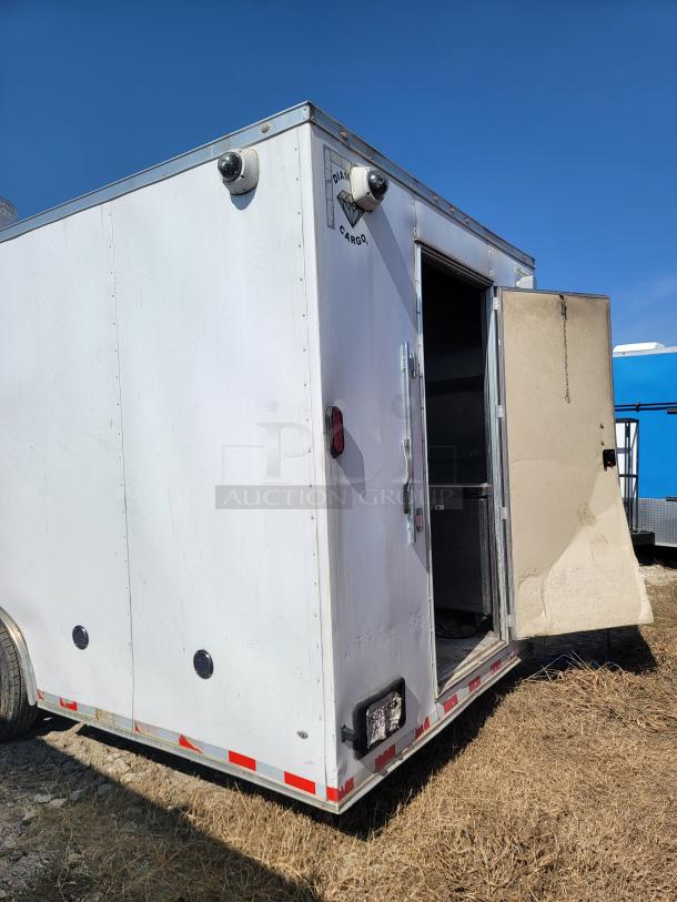 2021 Diamond Cargo 24' mobile kitchen trailer with open door, features premium cooking suite and fire suppression system.