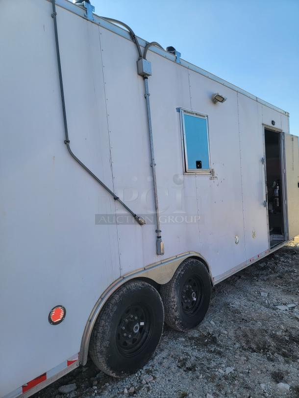 2021 Diamond Cargo 24' mobile kitchen trailer with dual axles, side window, and entry door; needs cleaning, VIN 53NBE2426M1089823.