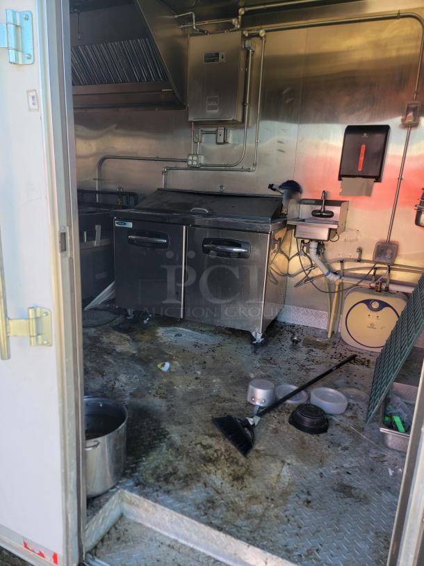 2021 Diamond Cargo 24' mobile kitchen interior with Royal cooking suite, Nor-Lake refrigeration, Ansul system; needs cleaning.