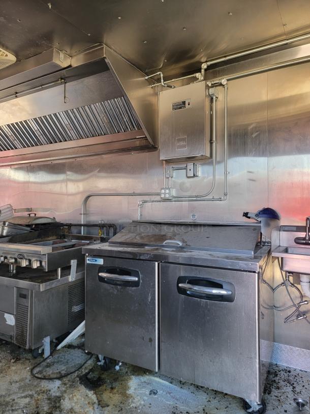 2021 Diamond Cargo 24' mobile kitchen interior featuring Royal cooking suite and Nor-Lake Advantage refrigeration; needs cleaning.