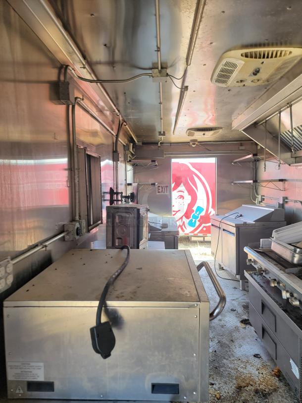 2021 Diamond Cargo 24' mobile kitchen interior, featuring a Royal cooking suite, Nor-Lake refrigeration, needs cleaning.
