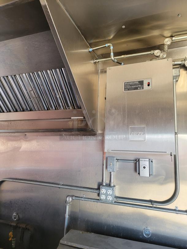 Interior view of 2021 Diamond Cargo 24' mobile kitchen. Features an Ansul fire suppression system, ductwork, and electrical outlets.