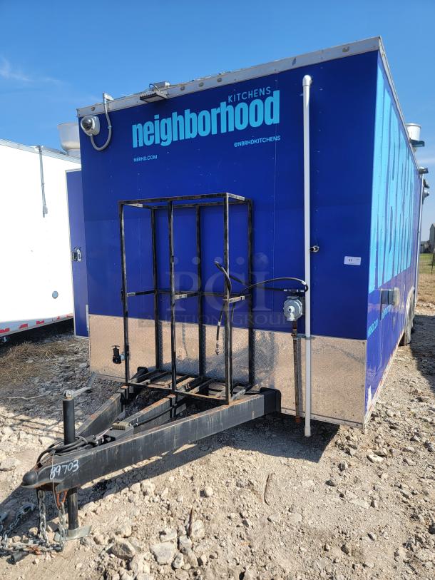 2021 Diamond Cargo 24' mobile kitchen in blue, with security cameras, towing hitch, and "Neighborhood Kitchens" branding.