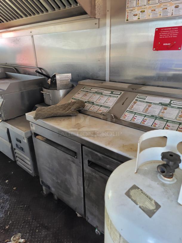 2021 Diamond Cargo 24' mobile kitchen interior featuring Southbend cooking line and Arctic Air refrigeration, in used condition.