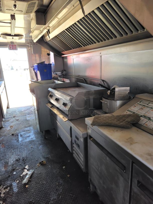 2021 Diamond Cargo 24' mobile kitchen interior with Southbend cooking line and Arctic Air fridge. Slightly worn condition.