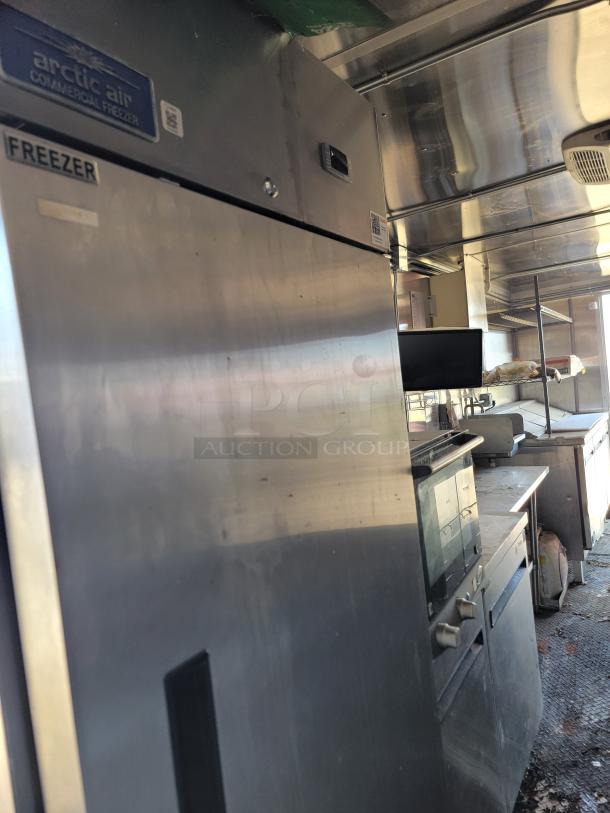 2021 Diamond Cargo 24' mobile kitchen interior with Arctic Air freezer, Southbend cooking line, in good condition.