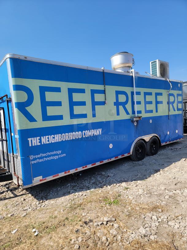 2021 Diamond Cargo 24’ mobile kitchen, blue with "REEF" branding. Features dual axles, industrial ventilation system.